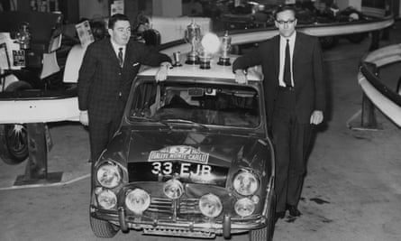 Paddy Hopkirk, left, with navigator Henry Liddon at Olympia in London in 1964, showing off the Mini Cooper in which they had just won the Monte Carlo Rally.
