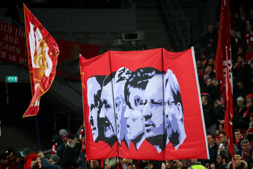 Liverpool fans hold up a banner of past managers that includes Rafael Benítez in February 2020.