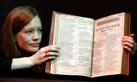 A member of Christie’s staff holds a copy of Shakespeare’s first folio, which sold for £1.87m.