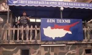 A Greek Cypriot soldier mans a checkpoint in Nicosia