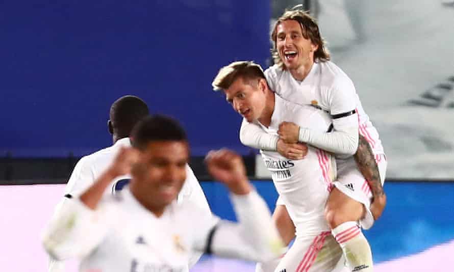 Toni Kroos joins the celebrations after his free-kick was deflected twice on its way into the Barcelona goal.