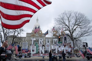 Protesters outside the state capitol in Lansing. The Michigan protest has sparked copycat rallies across the US.