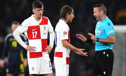 Luka Modric pleads the case of Petar Sucic (left) after he is sent off.