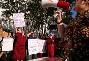 Pro-choice supporters protest in front of the Alabama state house as the state senate votes on the strictest anti-abortion bill in the US.