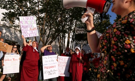 Pro-choice supporters protest in front of the Alabama State House.