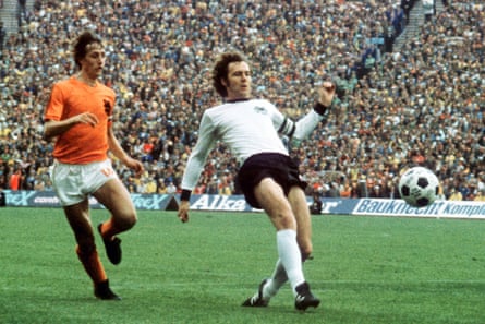 West Germany’s Franz Beckenbauer gets to the ball ahead of Johan Cruyff