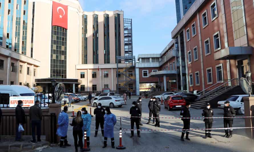 Police and security personnel stand guard outside the Sanko University hospital in Gaziantep after the incident.