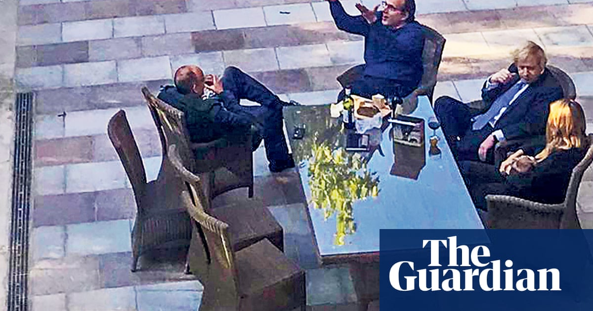 Boris Johnson and staff pictured with wine in Downing Street garden in May 2020 | Boris Johnson | The Guardian