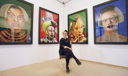ORLAN, photographed in front of her surgery-inspired self-portraits in 1999.