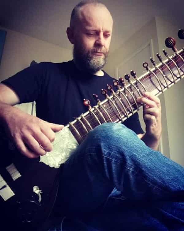 John Lancaster playing his sitar