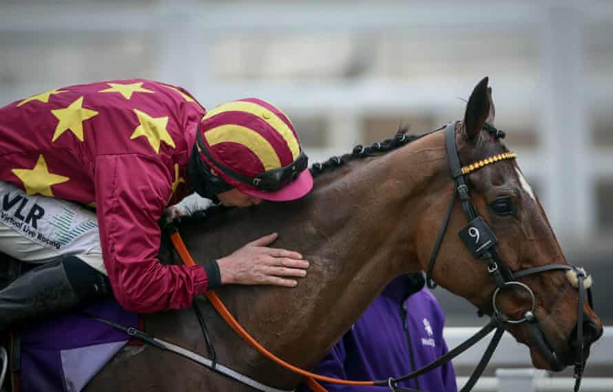 Minella Indo is congratulated with a kiss from Jack Kennedy.