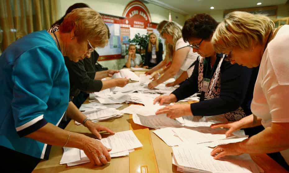 Votes are counted at a polling station in Minsk