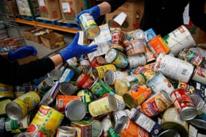 'A perfect storm': US facing hunger crisis as demand for food banks soars - The Guardian 7 George Washington University School of Medicine students sort canned and other non-perishable food as they wear disposable gloves at Capital Area Food Bank in Washington, Thursday, March 19, 2020.