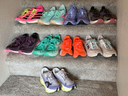 A collection of women’s running shoes arranged on a staircase