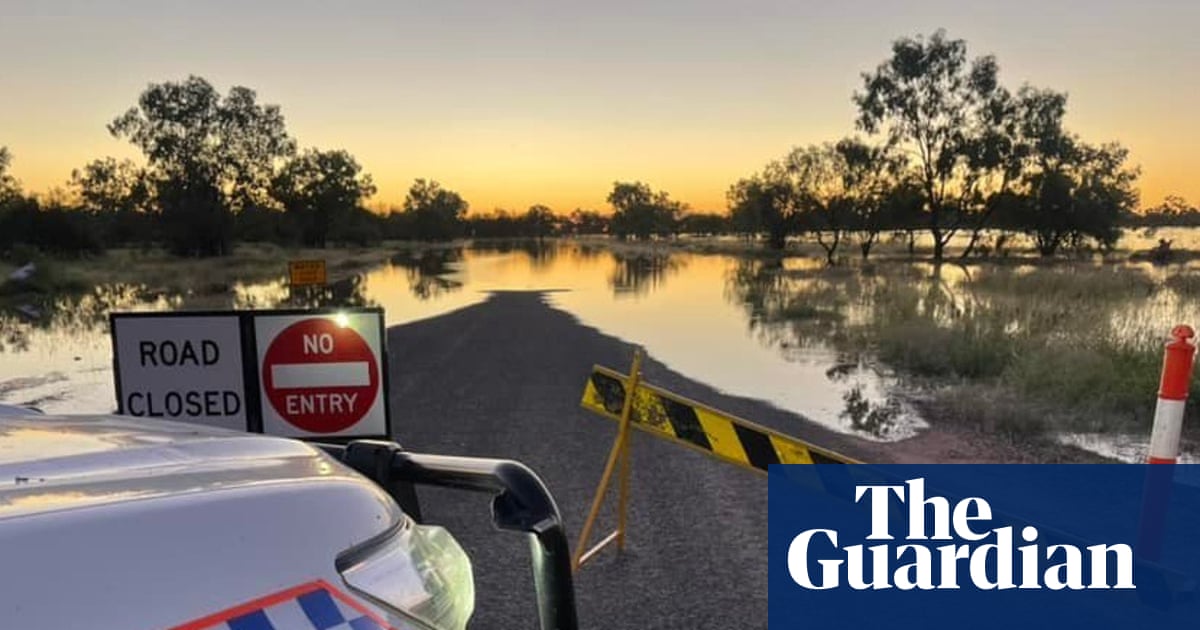 Queensland floods: woman dies after vehicle is swept away as more heavy rain forecast