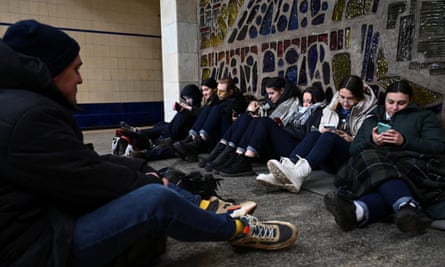 People sheltering from missile attacks inside a Kyiv metro station.