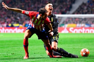 Cristiano Ronaldo of Juventus fights with Juanfran of Atletico Madrid.