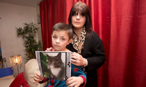 Amber Lewis and her son Liam, whose pet, Leo, was a victim of the cat killer. 