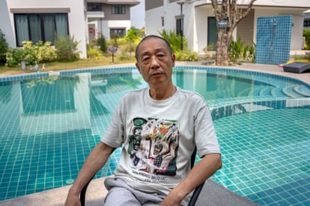 Chinese writer Ye Fu by the pool near his home in Chiang Mai