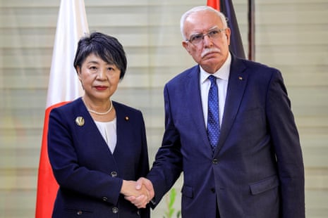 The Palestinian foreign minister, Riyad al-Maliki, receives Japan’s foreign minister, Yoko Kamikawa, in the city of Ramallah in the occupied West Bank.