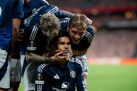 Casemiro receives congratulations after giving Manchester United the lead.