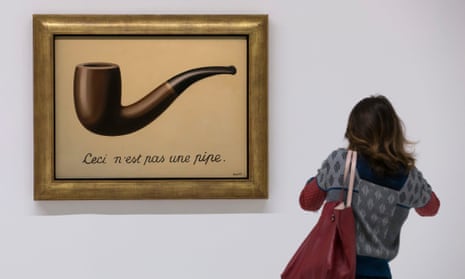 I can tell you what it isn’t … a visitor looking at Magritte’s 1929 painting La Trahison des Images, ceci n’est pas une pipe.