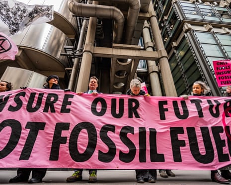 Protesters link arms outside Lloyds of London on Wednesday.