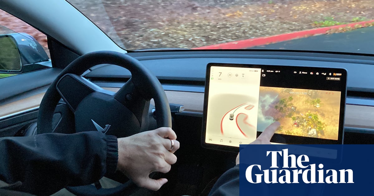 Tesla, bowing to pressure, stops allowing drivers to play video games while driving