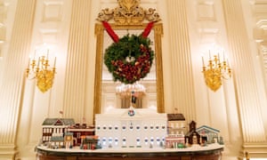 Covid frontline nurses, doctors, teachers and others are recognised in a gigantic gingerbread White House.