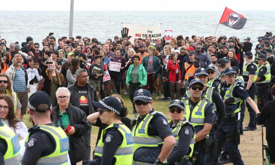 Police keep protesters apart at St Kilda on Saturday.