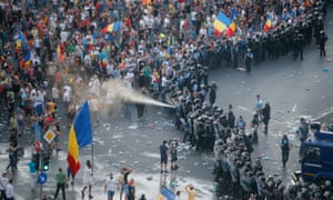 Police use pepper spray against the crowd during Friday’s protest
