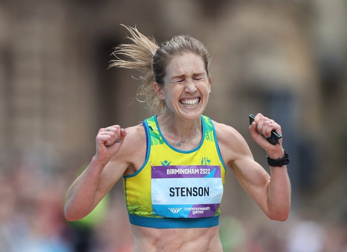 Australia’s Jessica Stenson celebrates as she crosses the line to win gold in the women’s marathon.