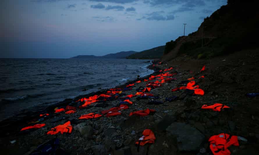 Life vests are left on the shore by refugees arriving in Lesbos in 2015.