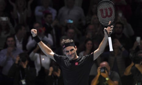 Roger Federer celebrates the winning match point against Novak Djokovic.