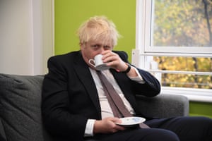 Boris Johnson having a drink this morning while he was on a visit to Woodgrange GP surgery vaccination centre in east London.