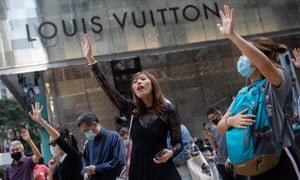 Pro-democracy protesters and office workers take part in a flash mob in Central district, Hong Kong