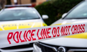 Police cars and cordon tape stock photograph