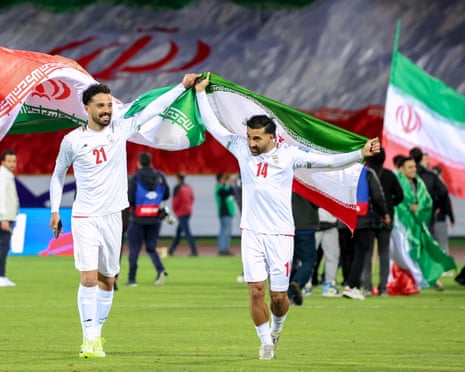 Iran’s players celebrate after a qualifier match against Uzbekistan in Tehran last year