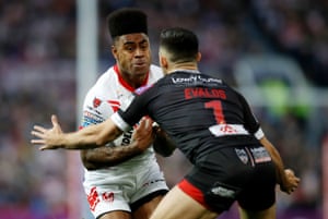 St Helens’ Kevin Naiqama (left) and Salford Red Devils’ Niall Evalds in action.