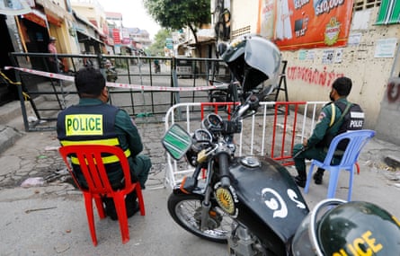 Police guard a blocked street in Phnom Penh.