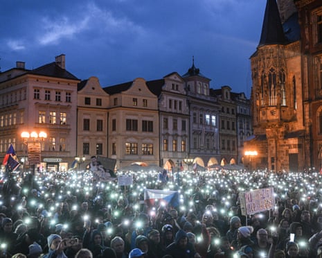People light their phones as they take part in a demonstration during commemorations to mark the 36th anniversary of the 1989 Velvet Revolution, at the Old Town square in Prague, Czech Republic.