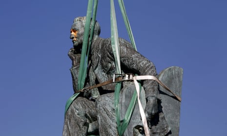 A statue of Cecil Rhodes is bound by straps as it awaits removal from the University of Cape Town in April 2015, after protests by students.