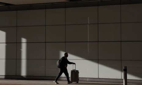 A traveller pushes a suitcase at London Heathrow during the pandemic.