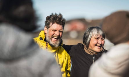 Mike Keen smiling with an Inuit woman