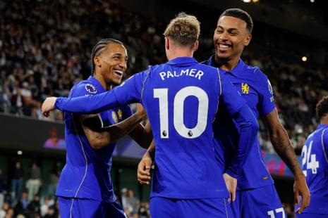 Chelsea's Cole Palmer celebrates scoring his side's third goal with Joao Pedro and Morgan Rogers.