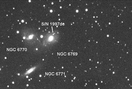 A black and white photo of the sky showing stars and four labels 