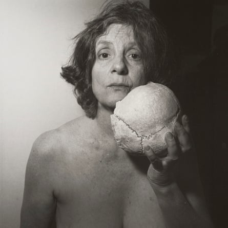 a woman holding a skull