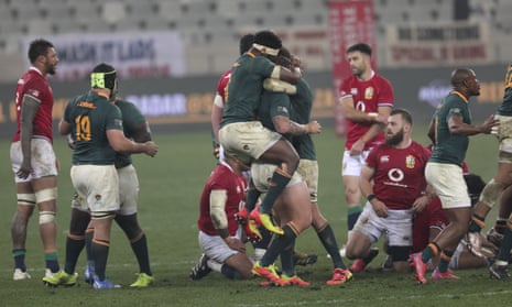 South African players celebrate at the end of the third rugby union test.