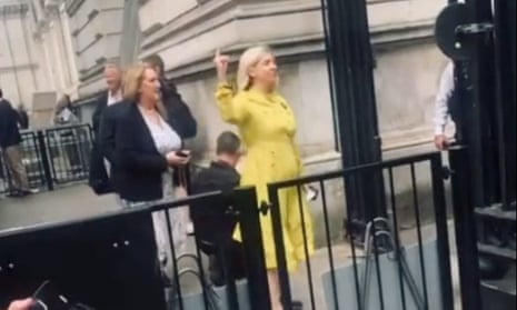Still from the video showing Andrea Jenkyns making a rude gesture at protesters