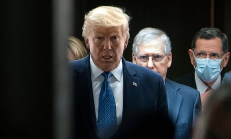 Donald Trump walks with Mitch McConnell on Capitol Hill in May.